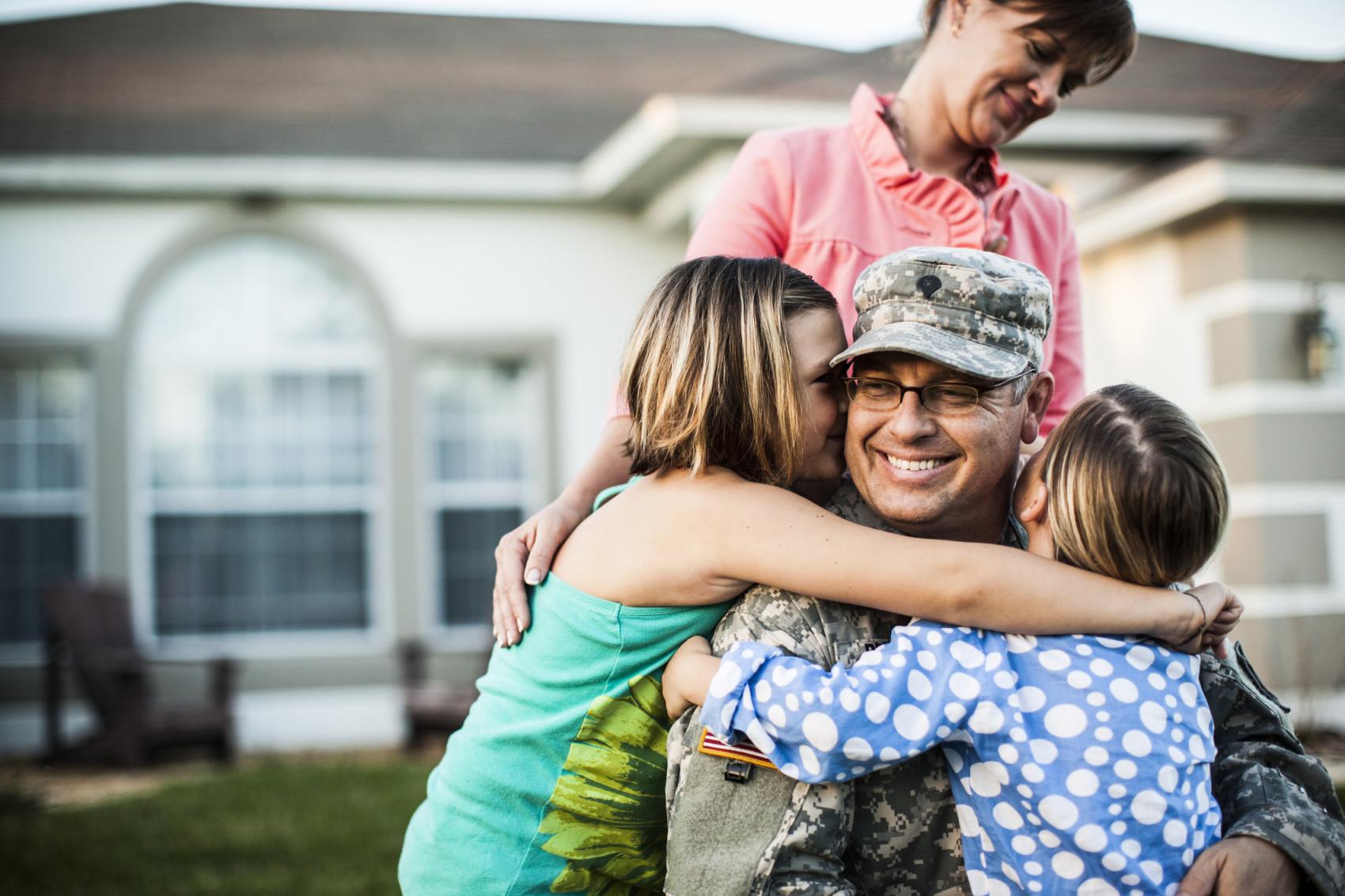 Military Family In Front of Home