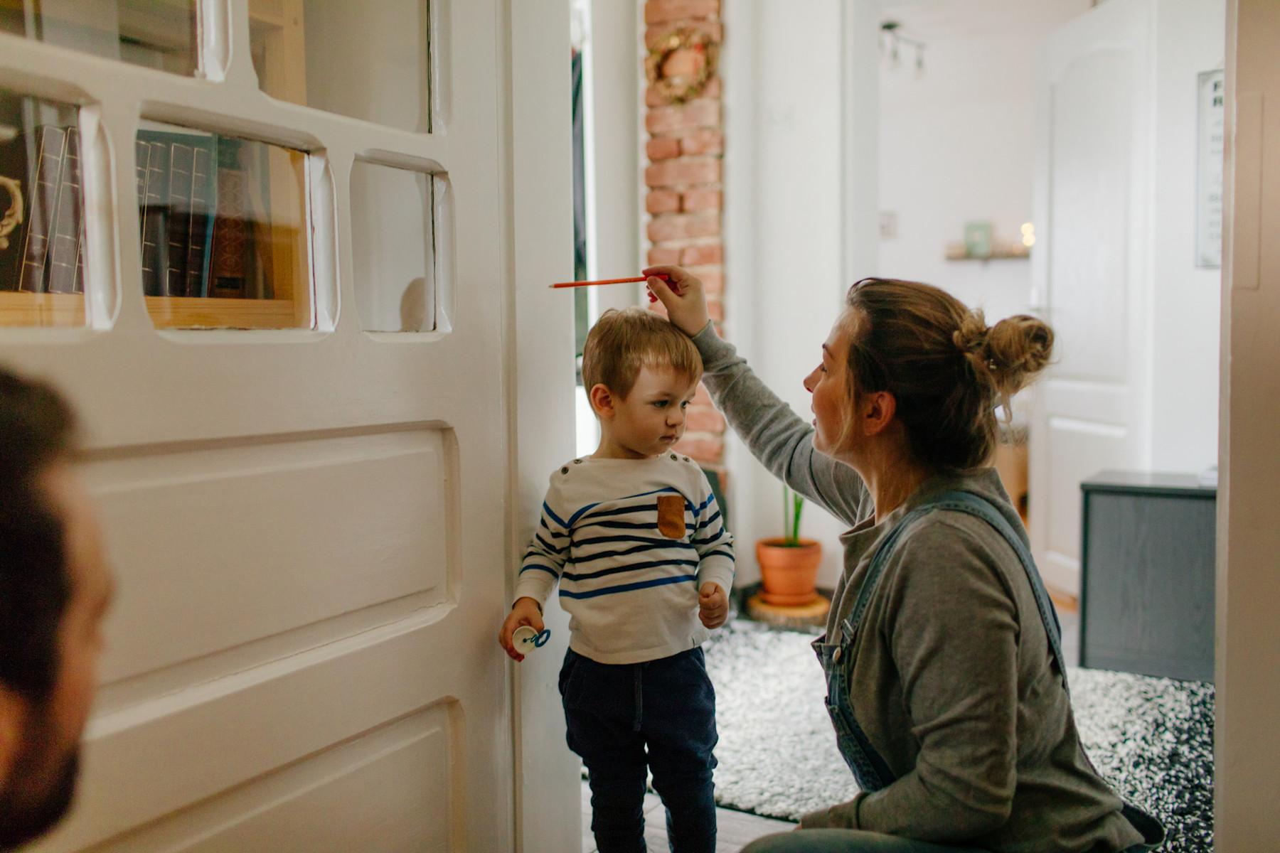 Mom playing with kids in living room