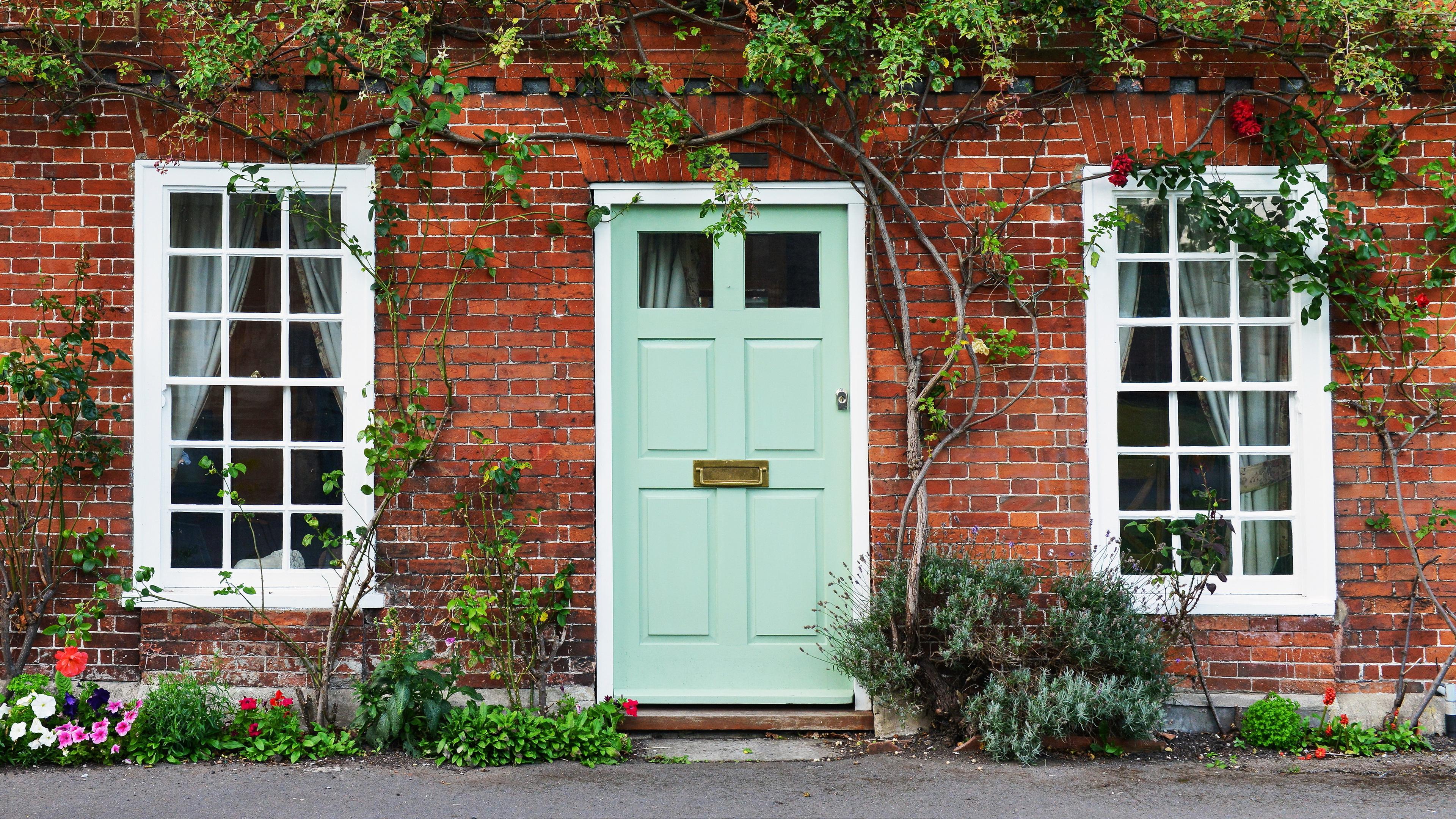 Green Door on brick wall