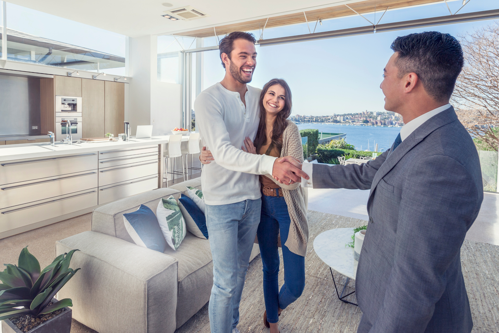 Couple Shaking Hands with Loan Officer